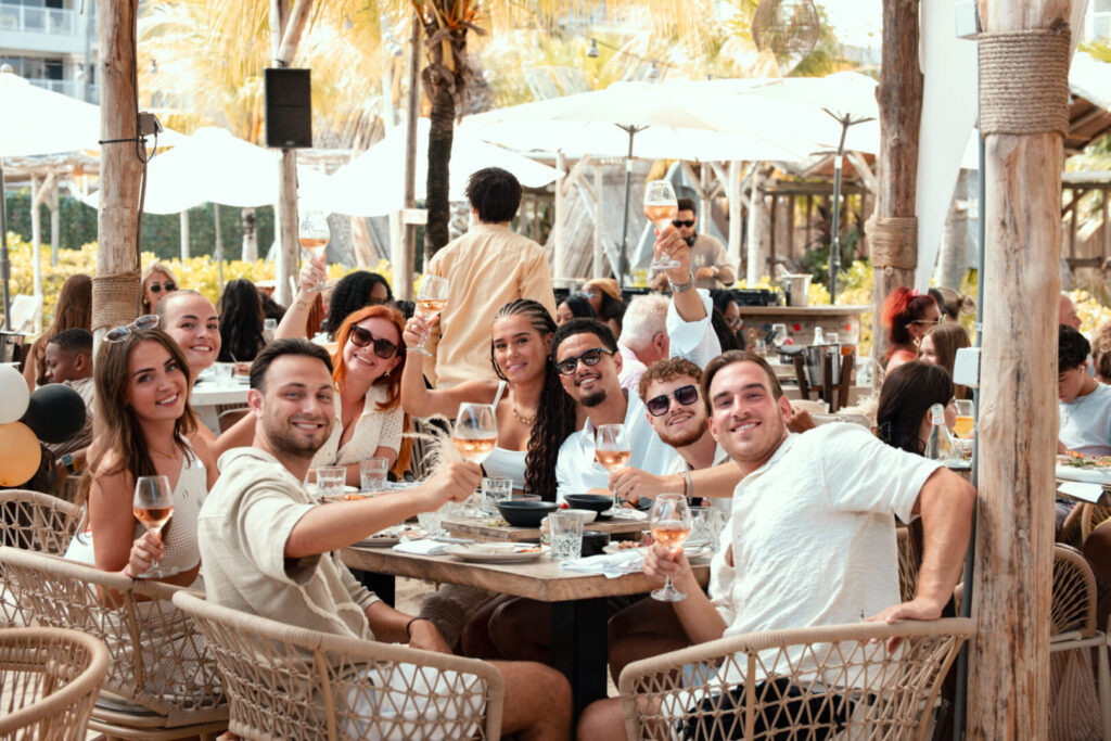 Guests dining together at Mood Beach restaurant