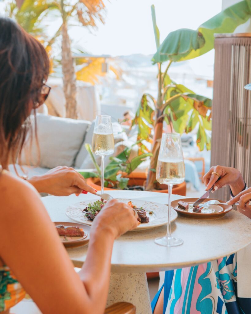 Guests dining at The Lemon Beach by the sea